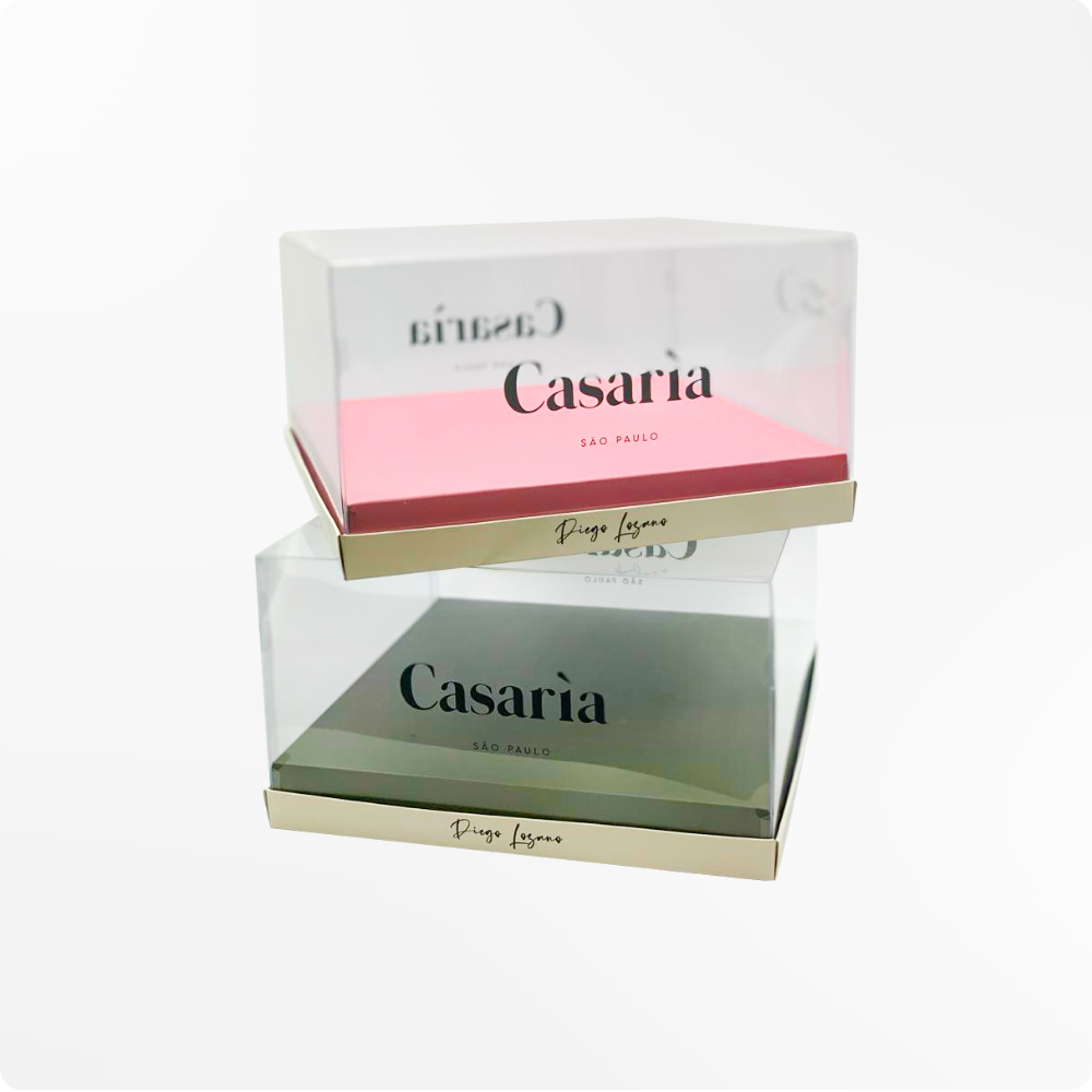 Caixas personalizadas Casarìa empilhadas com tampa transparente e bandejas rosa e verde